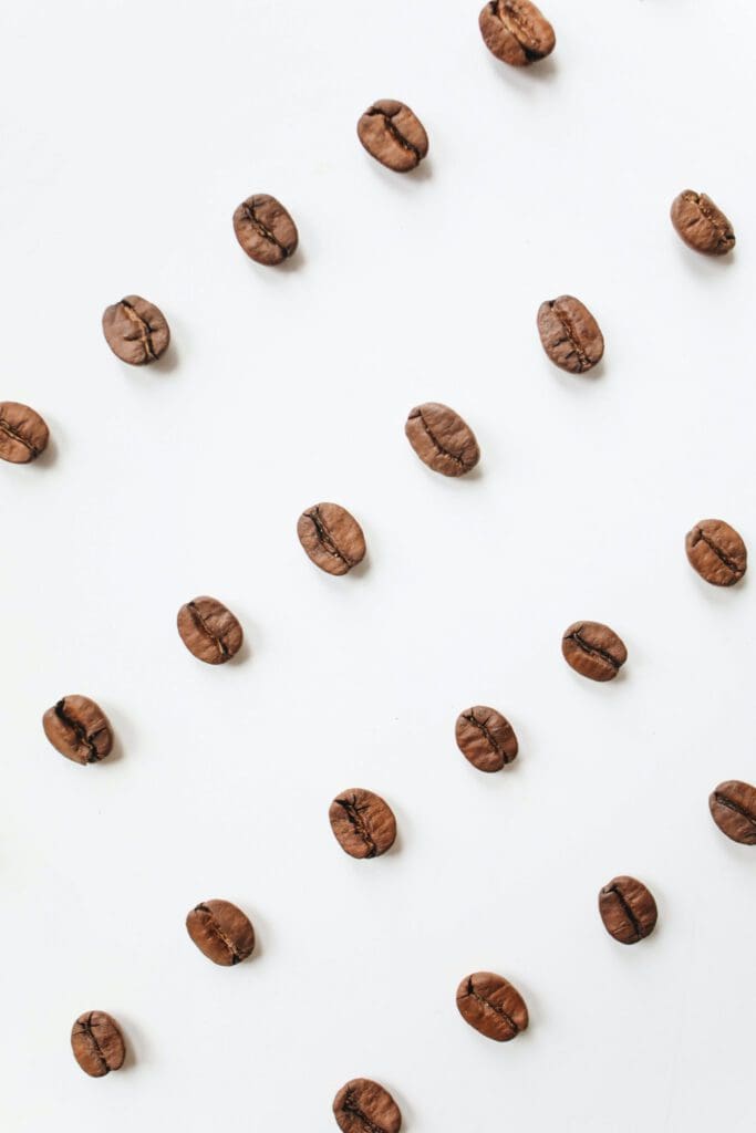 Coffee beans laid out diagonally in a line